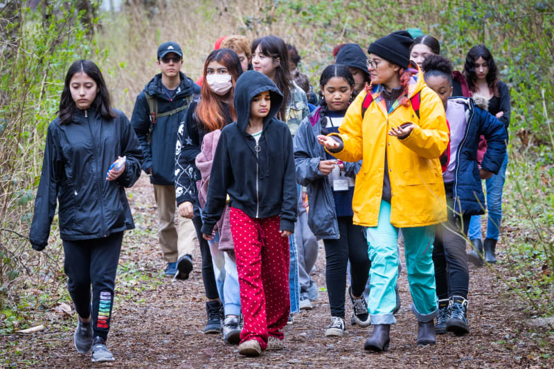 8/19 Seaport staff lead a group of students along a trail in Swan Creek Park.